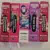 Five disposable vape boxes arranged in a row, featuring flavors like Strawberry Watermelon, Strawberry Cranberry Cherry, Grape Ice, with colorful graphics and nicotine content indicated on the packaging.
