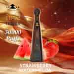 Strawberry and watermelon slices beside a tall dark tequila bottle labeled Don Leon 1942, with gold ribbons and a warm, sparkling background.