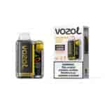Appareil de vapotage Vozoe Vista 20000 avec design en fibre de carbone et accents jaunes, présenté à côté de sa boîte colorée étiquetée Dragon Fruit Banana Cherry et boîte d'avertissement sur la nicotine.