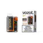 Appareil de vapotage Vozol Vista 20000 Lemon Lime dans un boîtier transparent avec accent orange à côté de son emballage montrant la marque et l'étiquette d'avertissement.