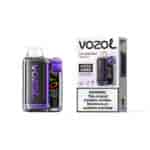 Appareil à dosettes Vozol Strawberry Mango Vista 20000 avec des accents violets à côté de sa boîte d'emballage comportant le logo Vozol et une étiquette d'avertissement.
