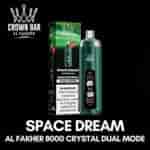 Space Dream e-cigarettflaska och grön låda med Crown Bar-märke, som visar 8000 kristall dubbelt läge och varningsetikett på en svart bakgrund.