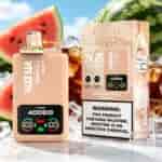 A peach-colored vape bottle labeled RAZZ BAR with a digital display, placed beside a boxed edition, against a backdrop of watermelon slices and ice.