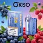 Bright blue and purple gradient background with blueberries and raspberries framing a boxed OKSO Blue Razz product and a blue vape device.