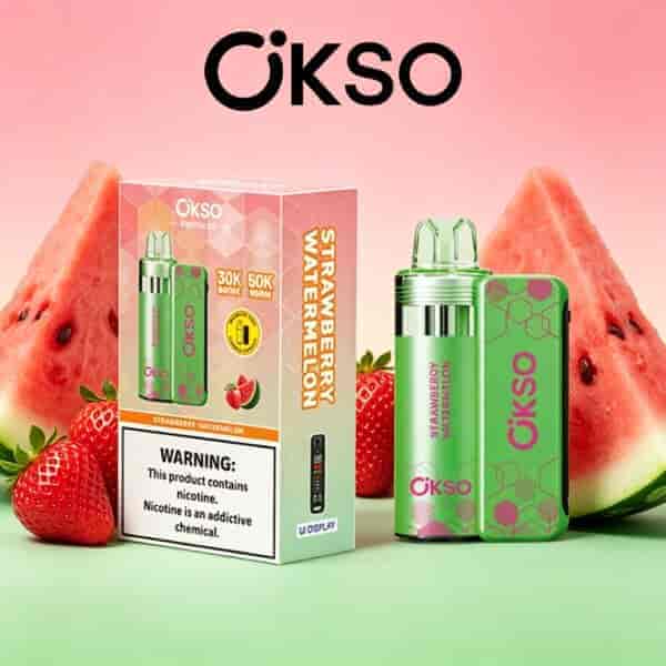 Strawberry watermelon OKSO vaping device with green patterned panel beside a matching box, set against pink dessert-themed background with watermelon slices and strawberries.