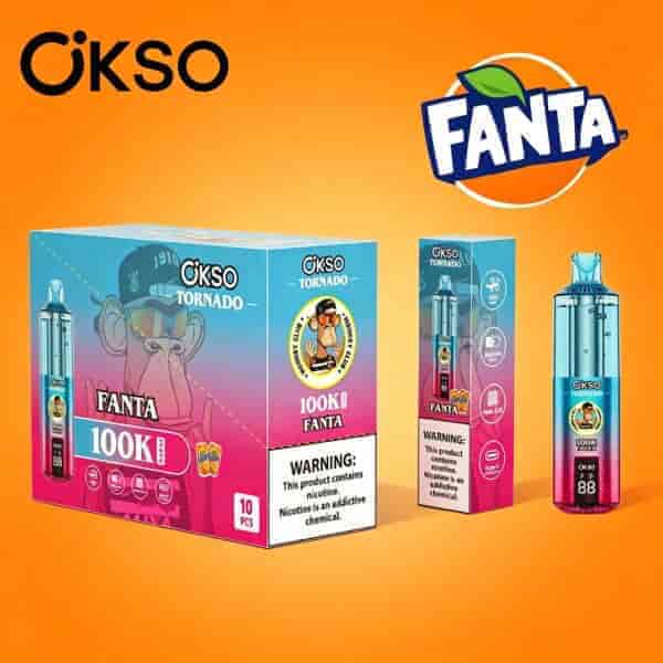 Esposizione di confezioni colorate per il marchio Okso Fanta, con diversi prodotti in scatola su sfondo arancione brillante e etichette di avvertenza.