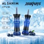 A blue vape device with "AL SAHIM" and "ATVS" branding, featuring a Type-C charging port and specifications like 1200mAh battery and 60ml e-liquid capacity, set against an icy background with blueberries