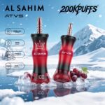 Two vape devices labeled "AL SAHIM" and "ATVS" in a snowy landscape, showcasing a "Grape Ice" flavor with technical specifications visible