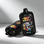 A colorful vape device with an elephant design on a black background, showing a digital display indicating battery level