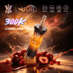 A vibrant vape device labeled "Cherry Fizz" is showcased, surrounded by splashes of cherry juice and fresh cherries