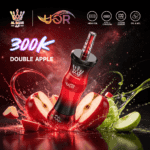 A vibrant vape device labeled "DOUBLE APPLE" surrounded by splashes of red and green apples, with promotional text "300K