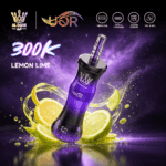 A purple vape device labeled "300K Lemon Lime" with a mesh coil, surrounded by splashes of lemon and lime slices