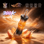 A stylish vape device labeled "Peach Ice" surrounded by splashes of liquid, with a peach sliced in half nearby